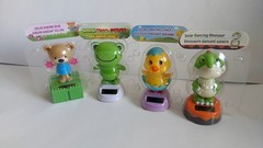 Solar Dancing Figures, Dino, Bear, Frog And Chick. Dance Exposed To Sunlight
